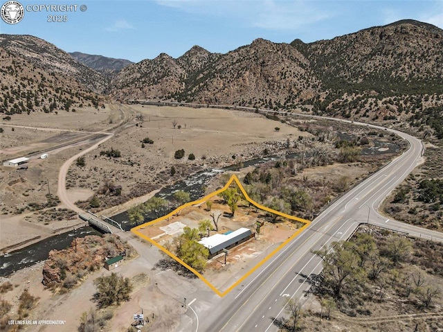 aerial view with a mountain view and a desert view