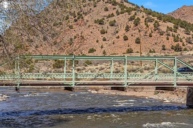 property view of mountains featuring a water view