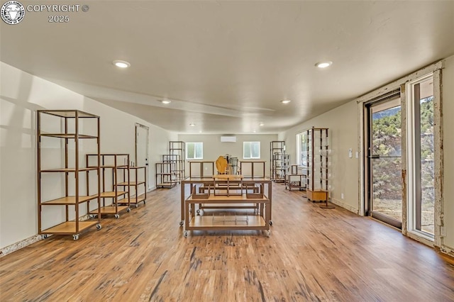 dining space featuring a wealth of natural light, recessed lighting, and wood finished floors