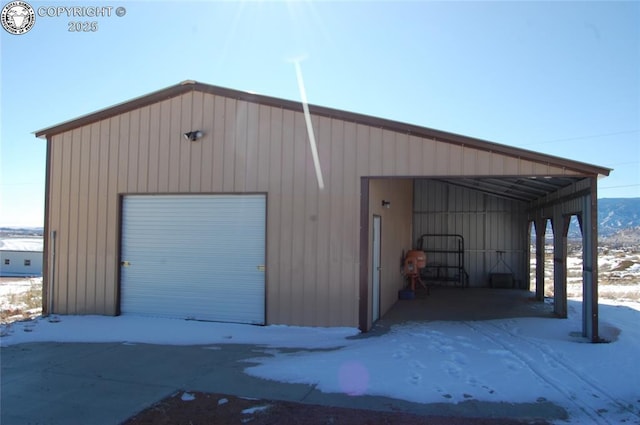 view of snow covered garage