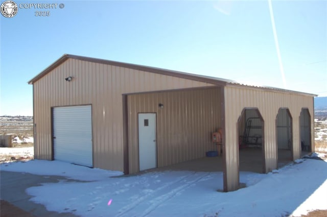 view of snow covered garage