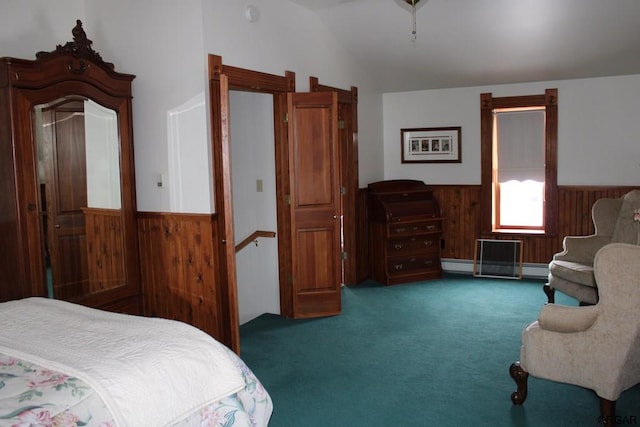 carpeted bedroom featuring baseboard heating and vaulted ceiling