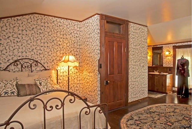 bedroom with dark wood-type flooring and lofted ceiling