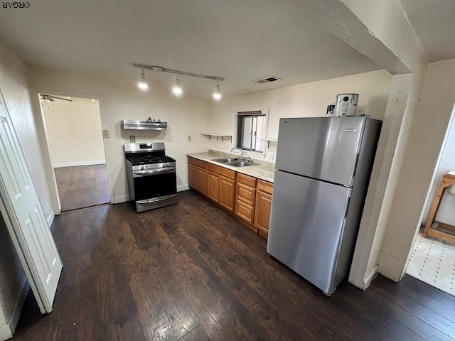 kitchen with sink, dark hardwood / wood-style floors, and appliances with stainless steel finishes