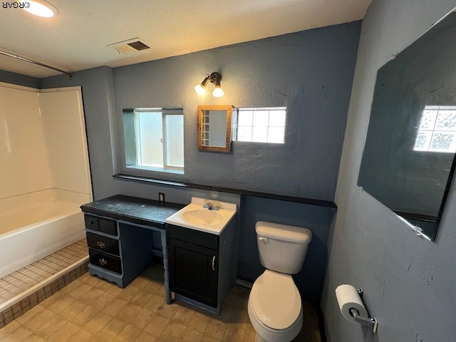 full bathroom with vanity, bathtub / shower combination, and toilet