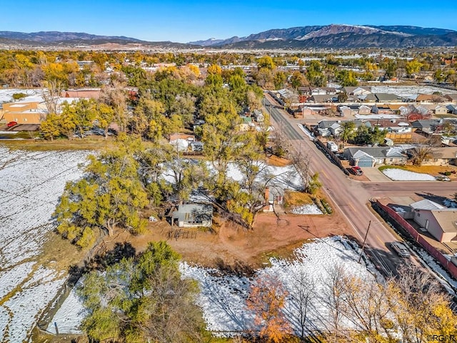 birds eye view of property featuring a mountain view