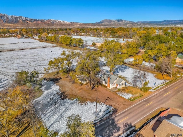 birds eye view of property with a mountain view