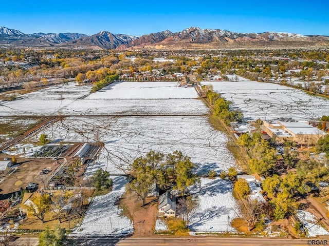 snowy aerial view with a mountain view