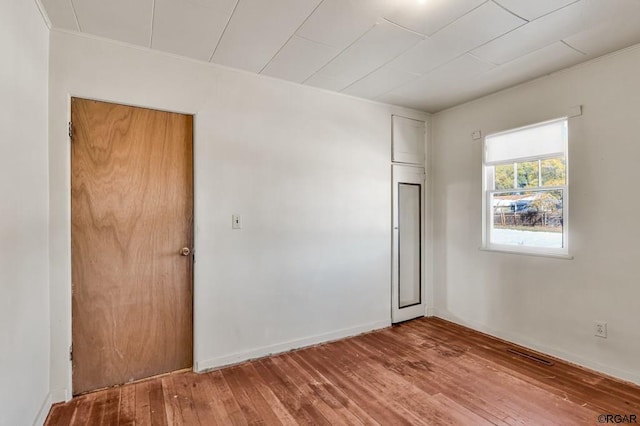 empty room featuring hardwood / wood-style flooring