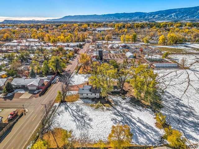 snowy aerial view with a mountain view