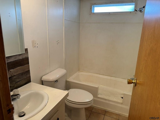 bathroom featuring tile patterned flooring, vanity, and toilet