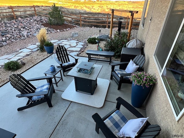 view of patio / terrace featuring an outdoor fire pit