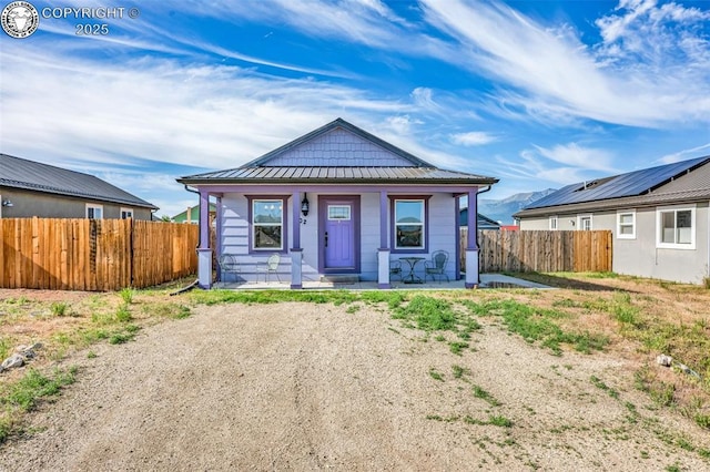 202 First St, Silver Cliff, CO 81252 - bungalow-style home with a standing seam roof, a metal roof, and covered porch