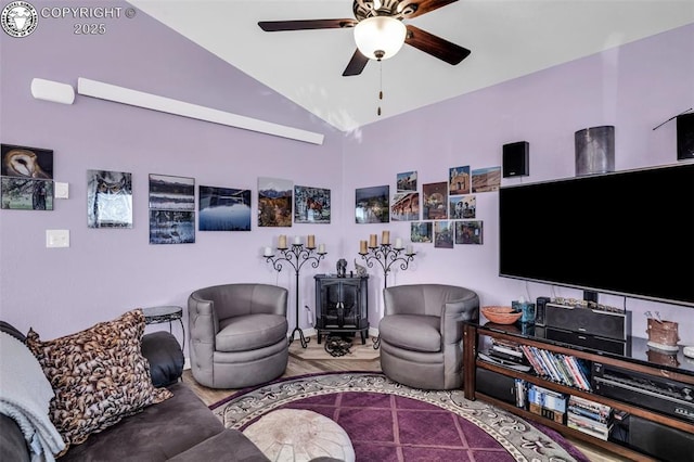 202 First St, Silver Cliff, CO 81252 - living room featuring a wood stove, ceiling fan, vaulted ceiling, and wood finished floors