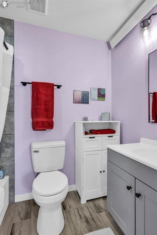 202 First St, Silver Cliff, CO 81252 - bathroom featuring vanity, wood finished floors, and shower / bathtub combination