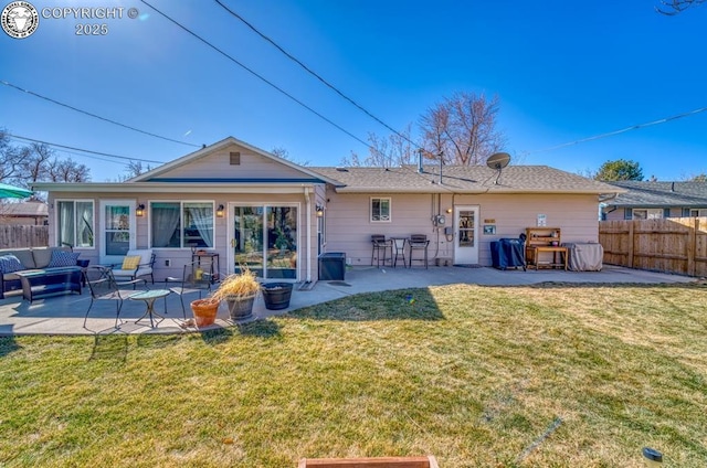 back of property featuring a patio area, a lawn, and fence