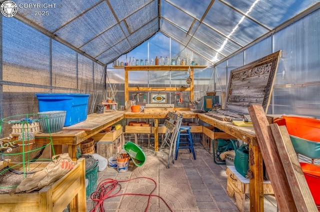 view of patio / terrace with a greenhouse