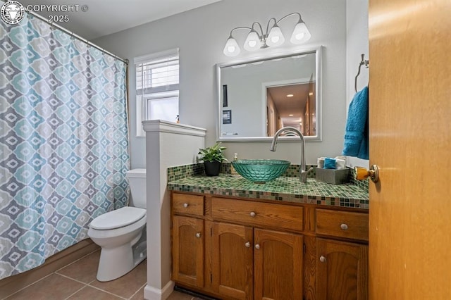 full bath with tile patterned floors, a shower with curtain, toilet, and vanity