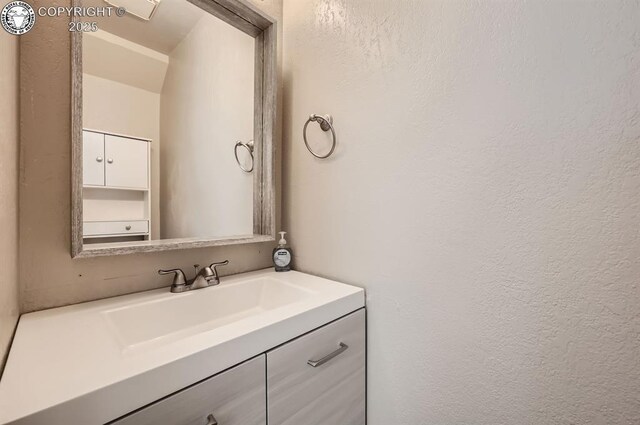 3210 Van Teylingen Dr, Colorado Springs, CO 80917 - bathroom featuring vanity and a textured wall