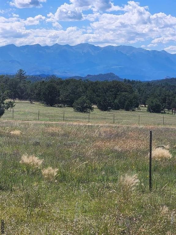 property view of mountains featuring a rural view