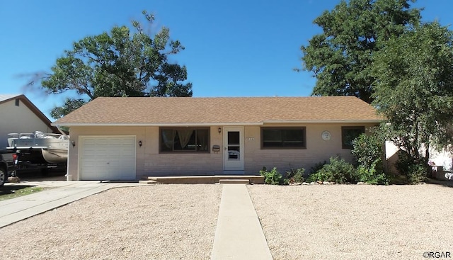 ranch-style house featuring a garage