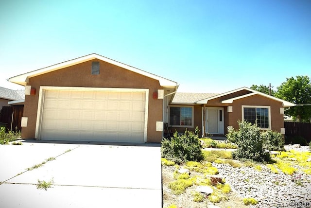 ranch-style house featuring a garage