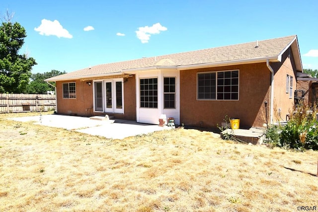 back of property with a patio area