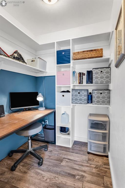 home office with wood finished floors