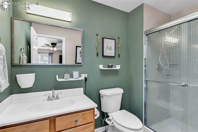 full bathroom with vanity, toilet, and a stall shower