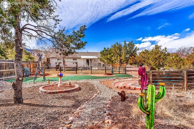 view of property's community with fence