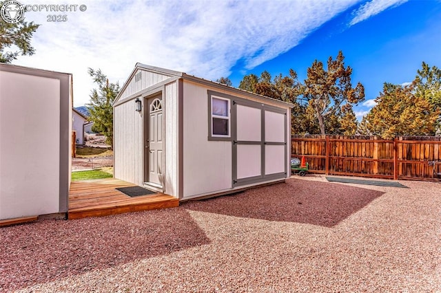 view of shed with fence