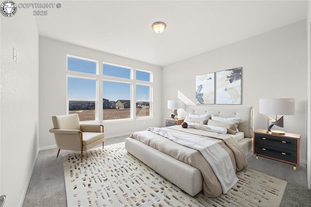 empty room featuring carpet floors, visible vents, and baseboards