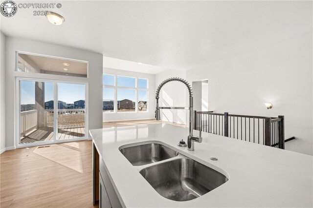 unfurnished room featuring visible vents, baseboards, and wood finished floors