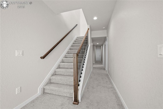 stairway with recessed lighting, carpet flooring, and baseboards