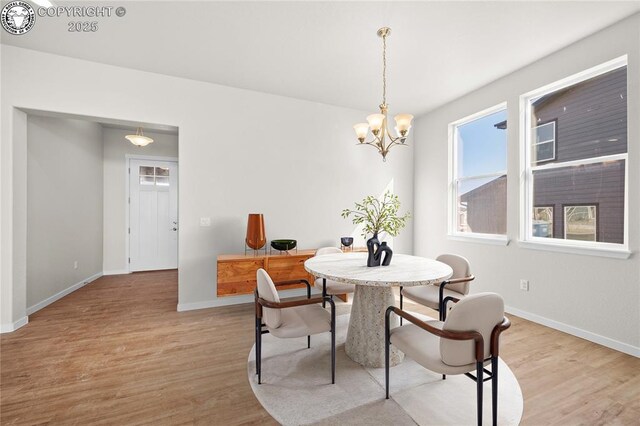 kitchen with light wood-style flooring, light countertops, and a sink