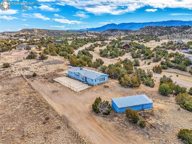 drone / aerial view featuring a mountain view