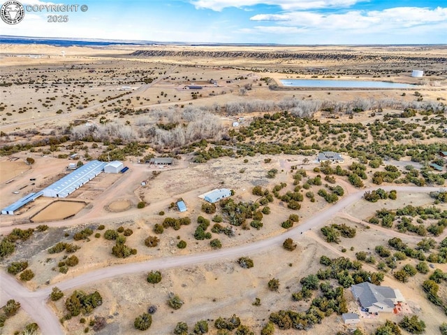 aerial view with view of desert and a rural view