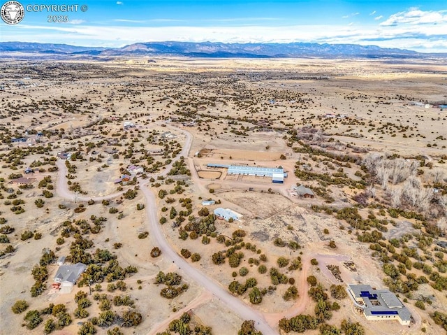 aerial view with a desert view and a mountain view