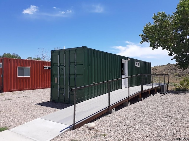 view of side of property featuring central air condition unit