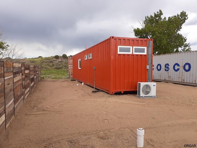 view of outbuilding featuring ac unit