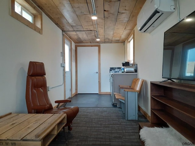 interior space featuring a healthy amount of sunlight, a wall mounted air conditioner, and wood ceiling