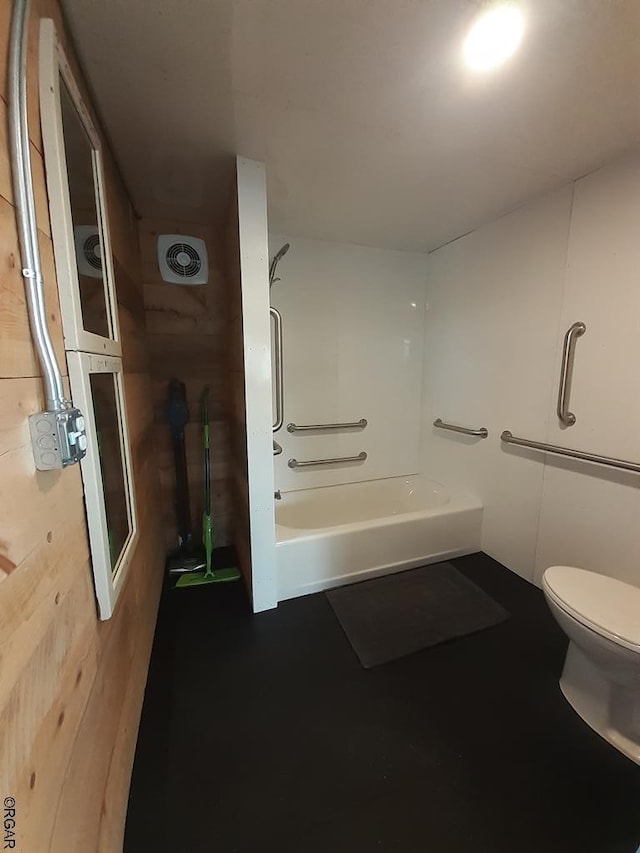 bathroom with shower / washtub combination and toilet