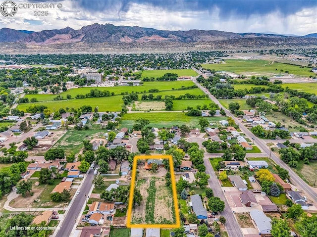 720 N 19th St, Canon City, CO 81212 - aerial view of residential area with property boundaries highlighted and a mountain backdrop