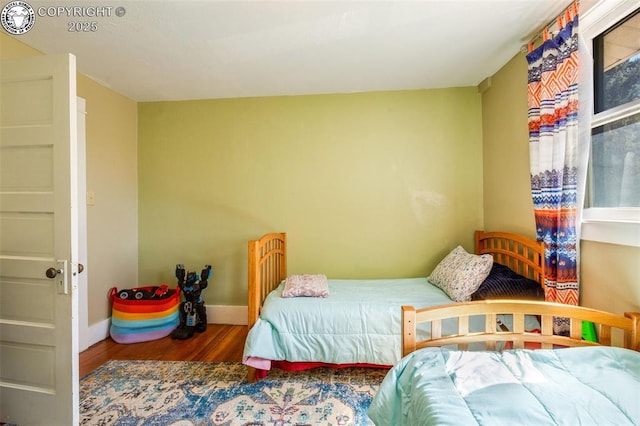 bedroom with wood-type flooring