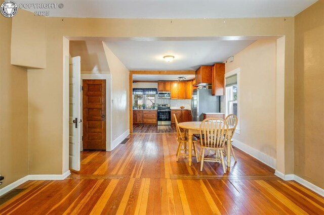 dining area featuring hardwood / wood-style flooring