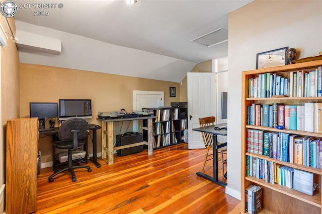 office featuring wood-type flooring and vaulted ceiling