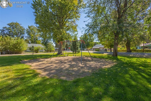 view of community with a yard and a playground