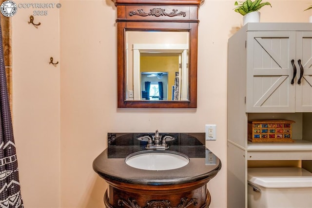 bathroom with vanity and toilet