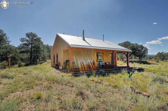 214 Durfee Cir, Westcliffe, CO 81252 - back of property with covered porch and metal roof