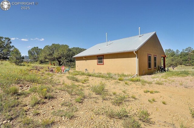 214 Durfee Cir, Westcliffe, CO 81252 - view of side of home featuring metal roof